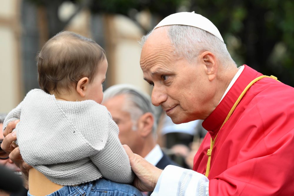 Pope Leo XIV greets a child as he arrives to celebrate Mass in Piazza Bartolo Longo in front of the Pontifical Shrine of the Blessed Virgin of the Rosary of Pompeii near Naples, Italy, May 8, 2026, on the first anniversary of his election as the first American pontiff. (OSV News/Vatican Media/Mario Tomassetti)
