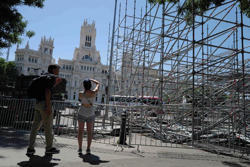 People take pictures near a steel tribune structure in Madrid May 28, 2026. The site is being prepared for an audience ahead of Pope Leo XIV's June 6-12 apostolic visit to Spain. (OSV News/Reuters/Kacper Pempel)