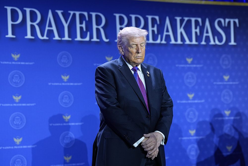 President Donald Trump bows his head during the National Prayer Breakfast Feb. 5, 2026, in Washington. (AP/Evan Vucci)