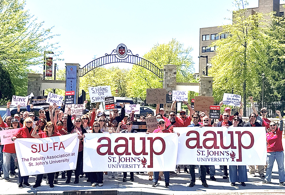 St. John's University faculty union members rally May 1 at the university gate to protest the administration's move to withdraw recognition of the faculty unions. (Courtesy of the St. John's University chapter of the American Association of University Professors)