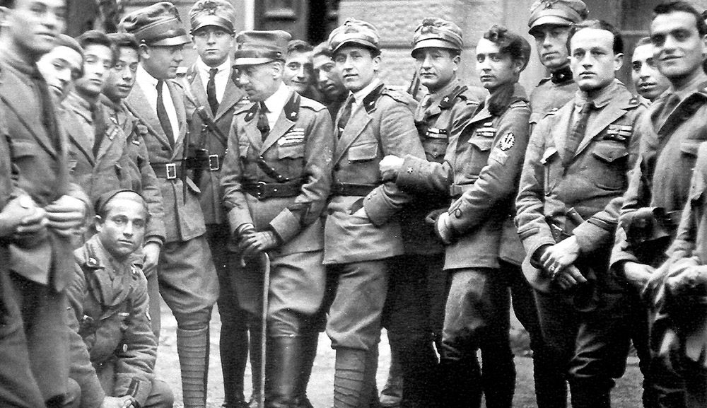 Gabriele D'Annunzio, holding a cane, is seen in a photo taken in 1919 in the city of Fiume — today Rijeka, Croatia. (Wikimedia Commons)
