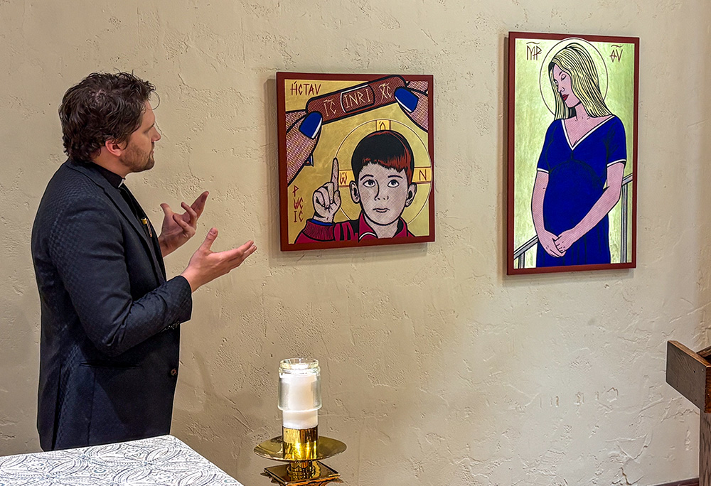 Jesuit artist Nicholas Leeper shows the artworks "The Crucifixion (Kiss it Better with Band-Aid)" and "Madonna del Parto (Once Upon a Time ... In Bethlehem)" during a press walkthrough for his exhibition "Twilight of the Idols" in St. Mary Chapel at St. Francis Xavier Church in New York, May 13, 2026. (NCR photo/Camillo Barone)