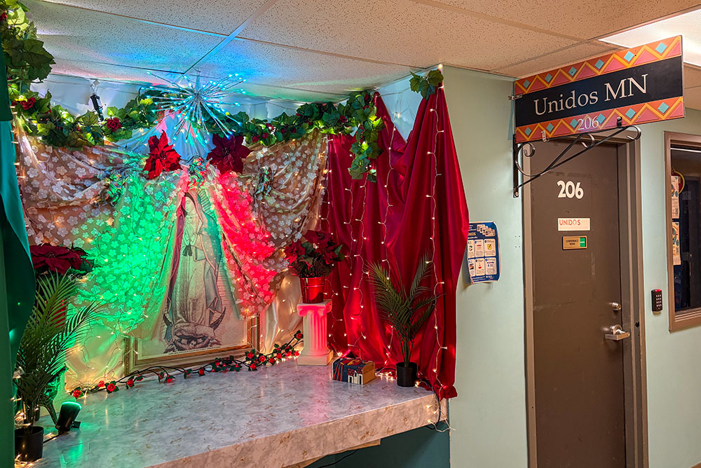 The entrance to Unidos MN on the upper floor of Mercado Central, next to an icon of Our Lady of Guadalupe, in South Minneapolis in May 2026. According to staff of Unidos MN, U.S. Immigration and Customs Enforcement entered Mercado Central in January. (NCR photo/Camillo Barone)