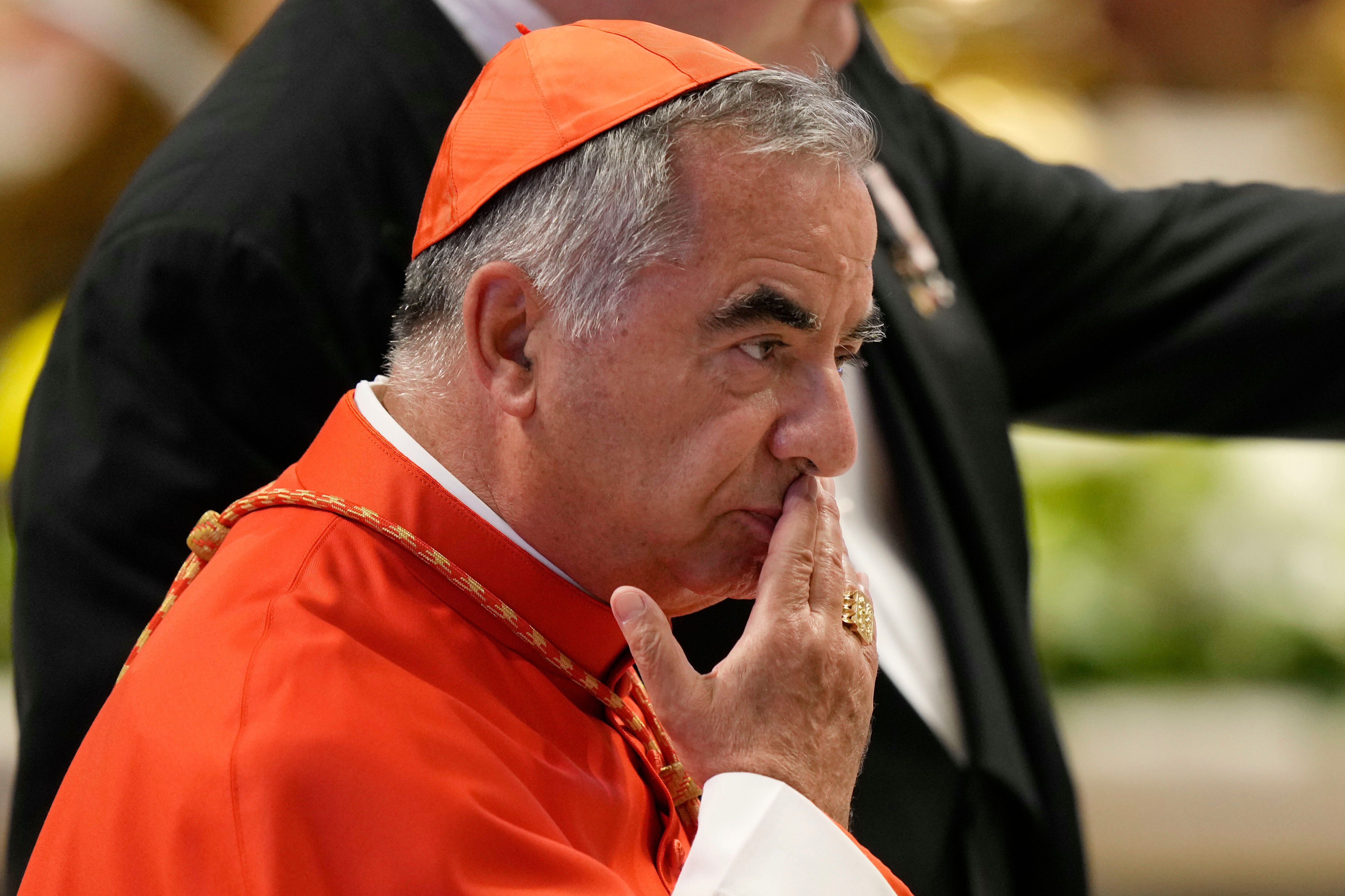 Cardinal Angelo Becciu attends the consistory inside St. Peter's Basilica at the Vatican, Aug. 27, 2022. 
