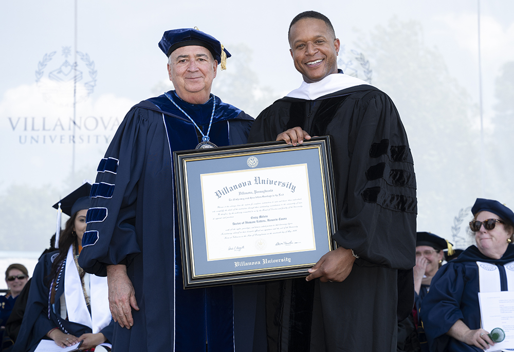 Augustinian Fr. Peter Donohue, Villanova University president, poses with Craig Melvin, co-host of "Today" who served as commencement speaker, at Villanova Stadium in Villanova, Pennsylvania, on May 19, 2026. Donohue read a message from Pope Leo XIV to the new graduates. (Courtesy of Villanova University) 