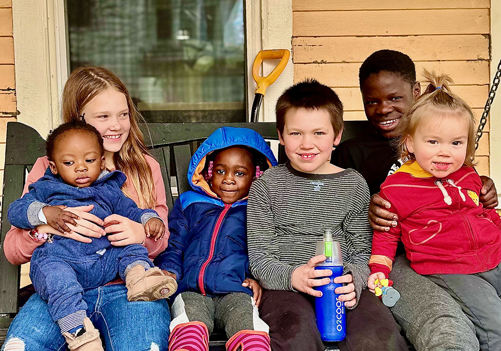 The author's grandchildren are pictured with Haitian family friends. (Courtesy of Bill Mitchell) 