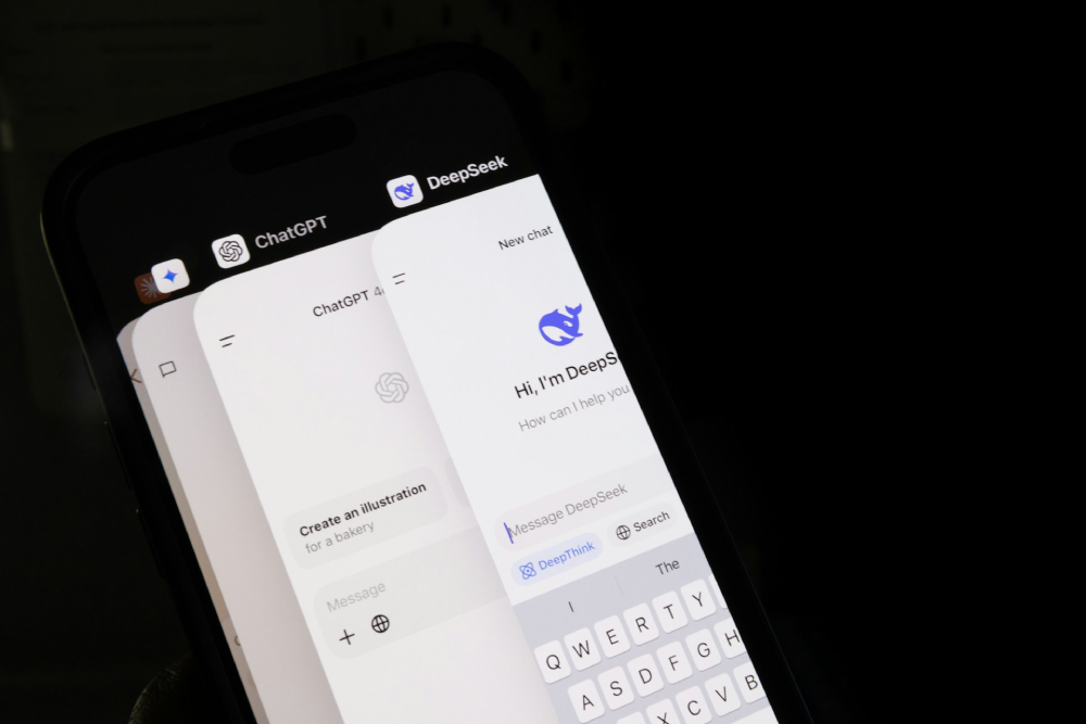 Google Gemini, ChatGPT and DeepSeek apps are open on a smartphone.