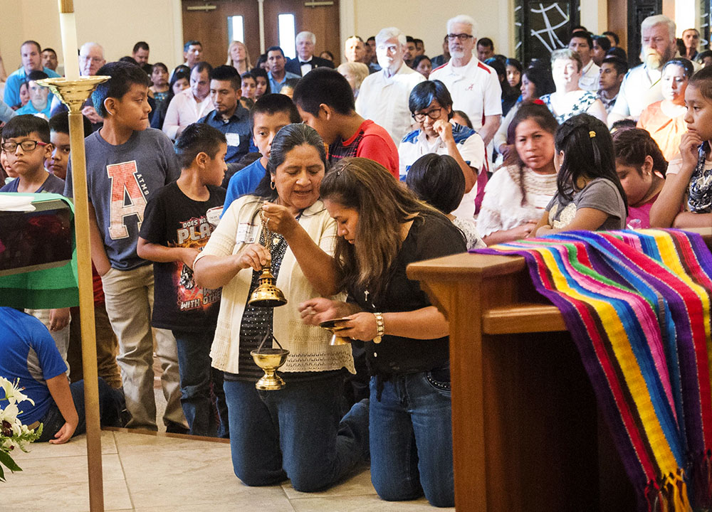 Catholics of Mayan ancestry attend Mass at St. Thomas Aquinas Church in Cookeville, Tenn., July 8, 2017. The Mass was part of a national Mayan conference celebrating traditional music, culture and spirituality. (CNS/Tennessee Register/Theresa Laurence)