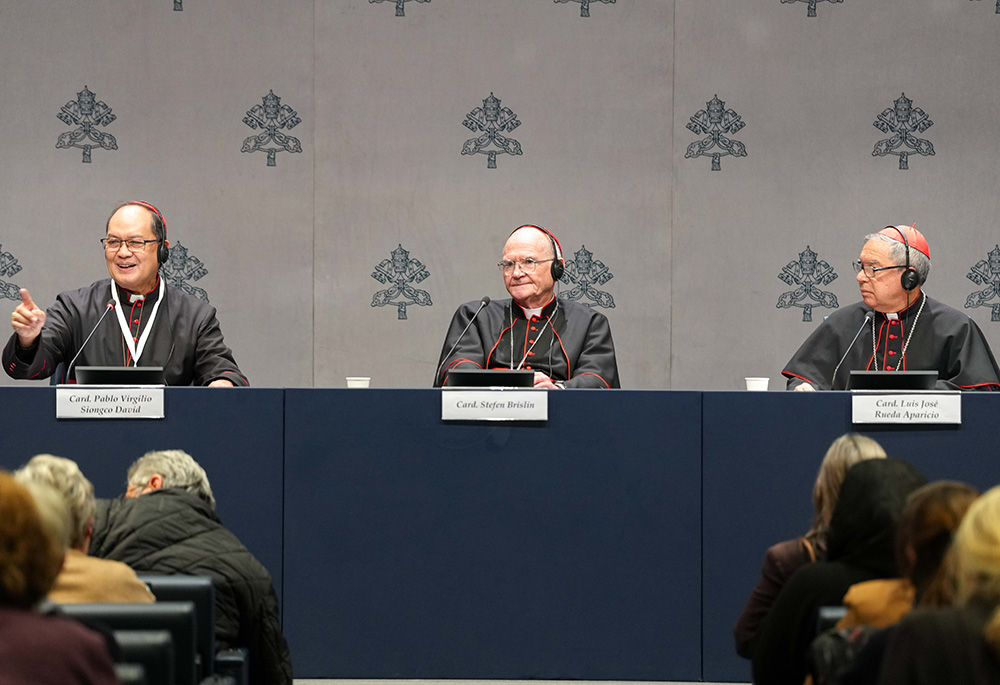 Cardinals Pablo Virgilio David of Kalookan, Philippines; Stephen Brislin of Johannesburg, South Africa; and Luis José Rueda Aparicio of Bogotá, Colombia, participate in a news conference at the Vatican about the consistory that had just concluded Jan. 8, 2026. (CNS/Lola Gomez)