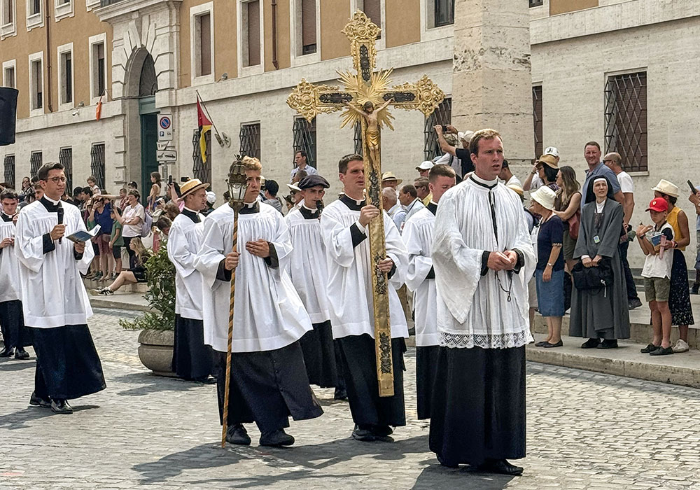 Seminarians and priests walk in procession to the Holy Door of St. Peter's Basilica at the Vatican Aug. 21, 2025. The men were among about 8,000 people who joined a pilgrimage sponsored by the traditionalist Society of St. Pius X. (CNS/Cindy Wooden)