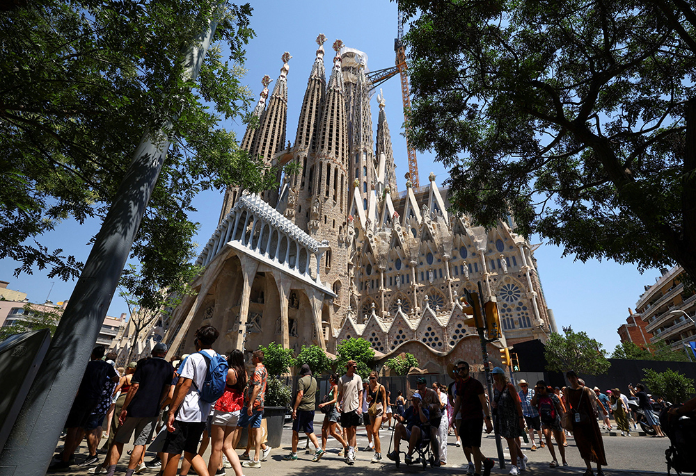 Groups of tourists walk around the Basilica of the Holy Family, known in Spanish as Sagrada Familia, in Barcelona, Spain, June 30, 2025. (OSV News/Reuters/Albert Gea)