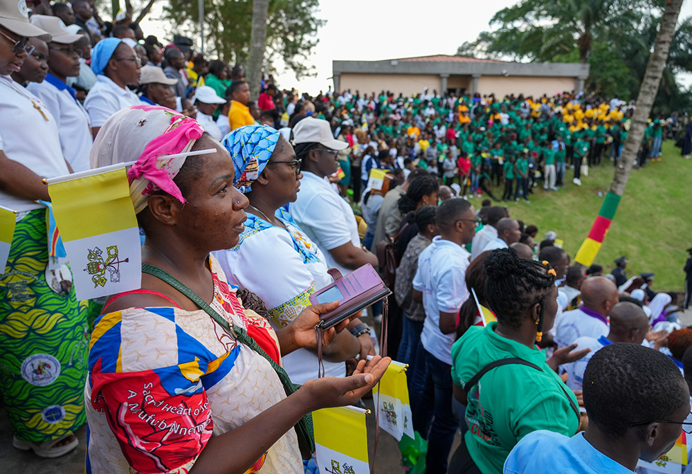 Men and women pray during Pope Leo XIV's meeting with the university community at the Catholic University of Central Africa in Yaoundé, Cameroon, April 17, 2026. (CNS/Lola Gomez)