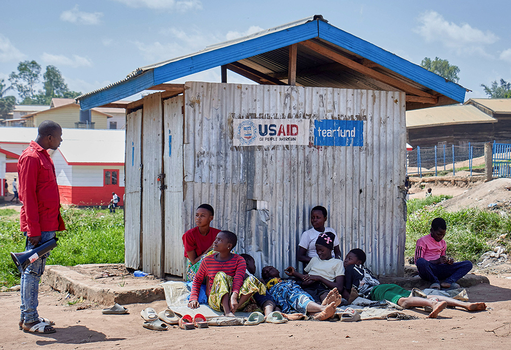 Richard Mbagaro, a supervisor at the Kigonze camp for internally displaced persons, speaks to residents in Bunia, Congo, May 25, 2026, urging them to wash their hands with soap or ash as fears grow over the spread of Ebola, as authorities intensify efforts to contain an Ebola outbreak caused by the Bundibugyo virus. (OSV News/Reuters/Gradel Muyisa Mumbere)