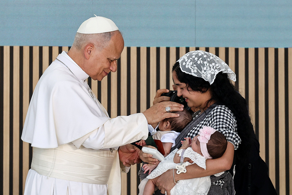 Pope Leo XIV meets with Niurka, a migrant woman from Cuba, and her children, during a meeting with staff and beneficiaries of "CEDIA 24 Horas Social Project," a Caritas center to support the homeless and financially vulnerable, in Madrid on June 6, 2026. (OSV News/Reuters/Yara Nardi)
