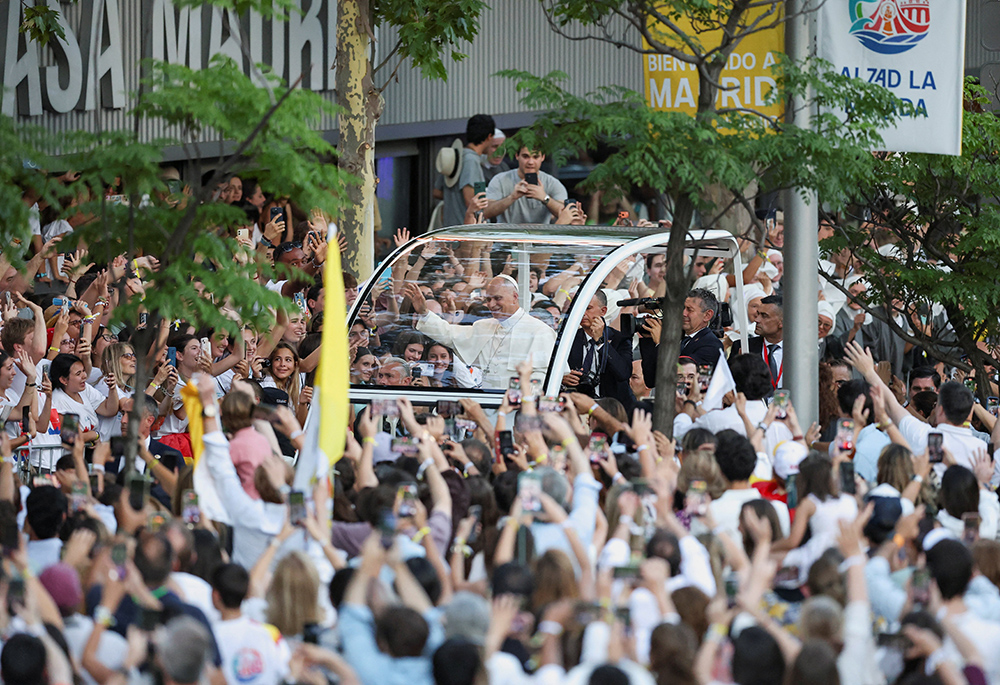 Pope Leo XIV greets faithful from the popemobile ahead of a prayer vigil at Plaza de Lima in Madrid June 6, 2026, during his apostolic journey to Spain. (OSV News/Reuters/Mohammad Salem)