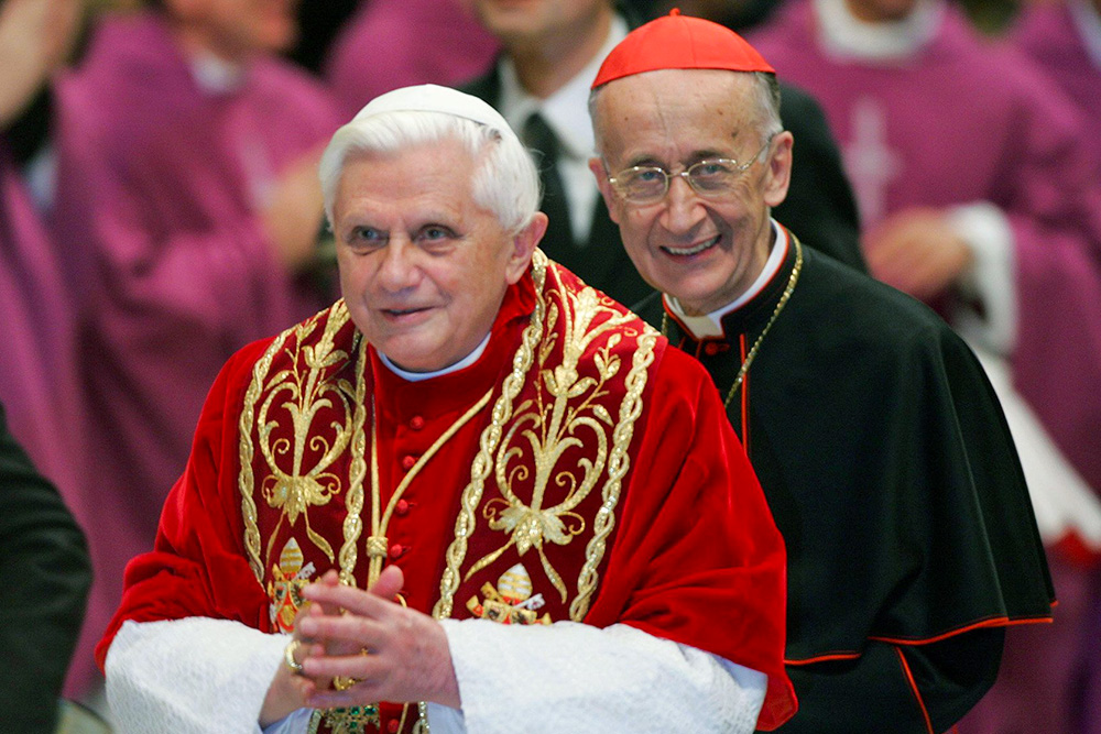 Pope Benedict XVI and Cardinal Camillo Ruini smile following a special Mass for university students in St. Peter's Basilica Dec. 15, 2005. (CNS/Catholic Press Photo/Alessia Giuliani)