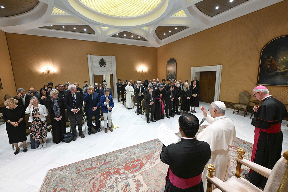 Pope Leo XIV gives a blessing after meeting with writers from around the world at the Capitolare Hall of St. Peter's Basilica at the Vatican June 24, 2026, to mark the 100th anniversary of the Holy See's publishing house, Libreria Editrice Vaticana. (OSV News/Vatican News/Simone Risoluti)