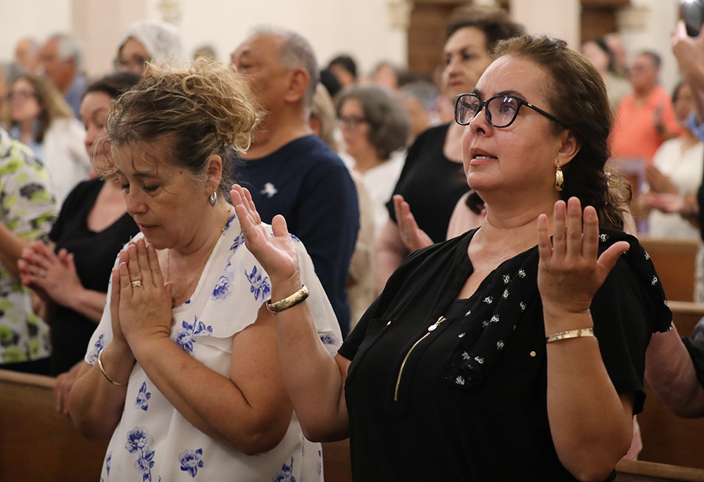 Women pray during Border Mass 250, a binational gathering of faith, solidarity and recognition of the contributions of immigrants, at Sacred Heart Church in Nogales, Arizona. (OSV News/Bob Roller)