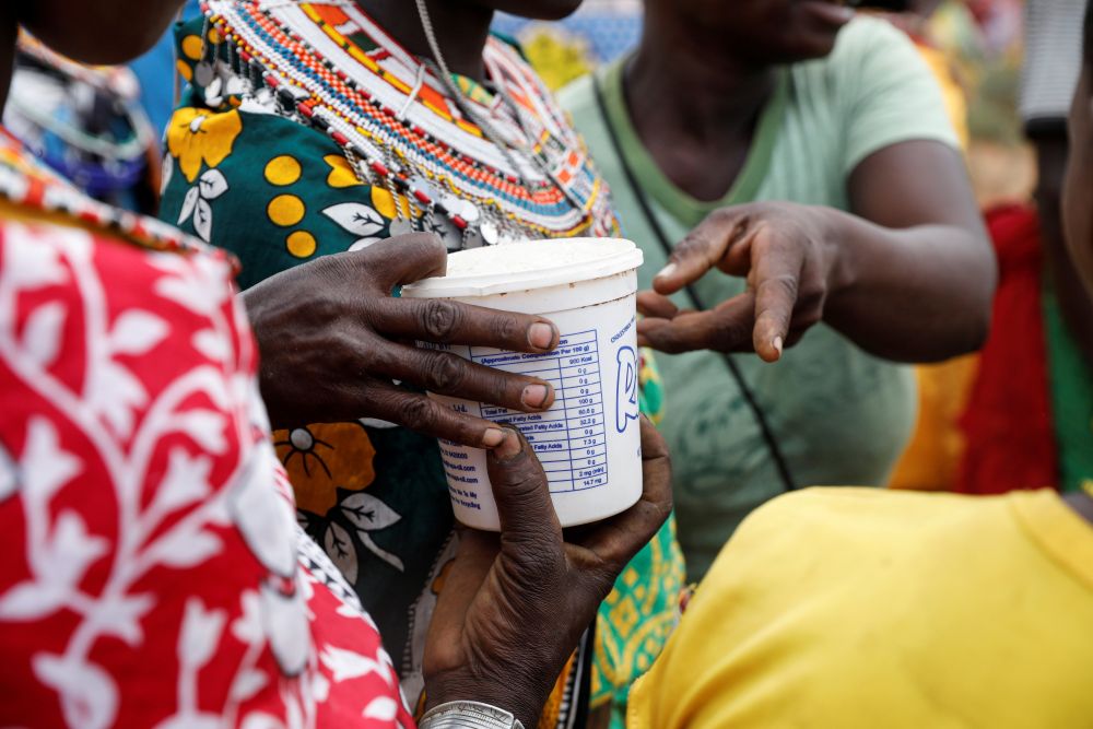 Women from the Samburu tribe receive a food donation during a drought in Oldonyiro, Kenya, Oct. 8, 2021. (CNS/Reuters/Baz Ratner)
