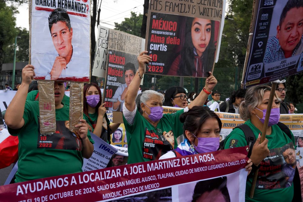 Relatives of Mexico's disappeared march before the opening day of the 2026 FIFA World Cup in Mexico City, Thursday, June 11, 2026. (AP/Alejandro Cegarra)