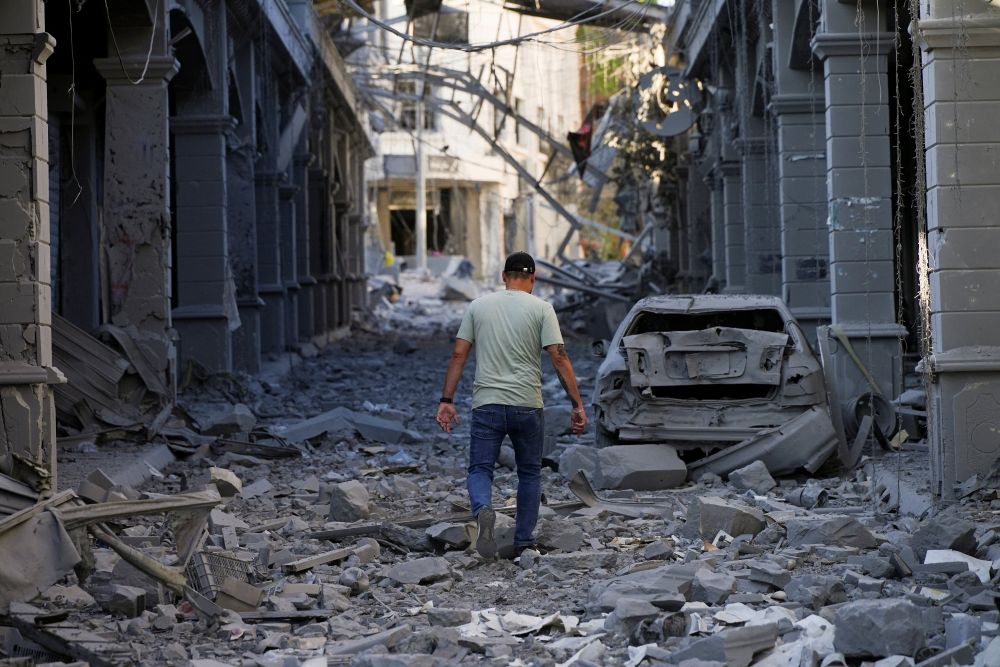 A man walks amidst rubble in the aftermath of Israeli strikes in Nabatieh, Lebanon, June 15, 2026. (OSV News/Reuters/stringer)