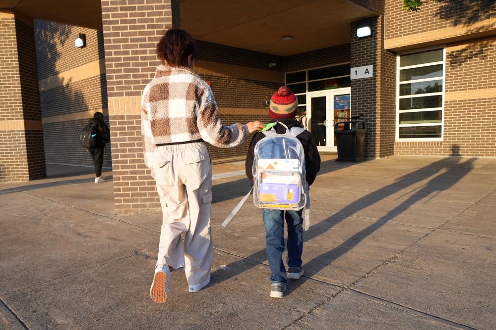 Maria Contreras, left, walks her son, Ian Contreras, to school April 9, 2026, in Fort Worth, Texas. (AP/Julio Cortez)