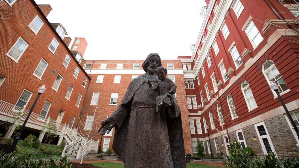 Isaac Hawkins Hall is seen on the campus of Georgetown University April 4, 2017. The hall, previously known as Mulledy Hall and later Freedom Hall, was renamed in 2017 for one of the 272 enslaved men, women and children sold by Georgetown's Jesuit community to plantation owners in Louisiana in 1838. Hawkins was the first enslaved person listed in the sale documents. (CNS/Tyler Orsburn)