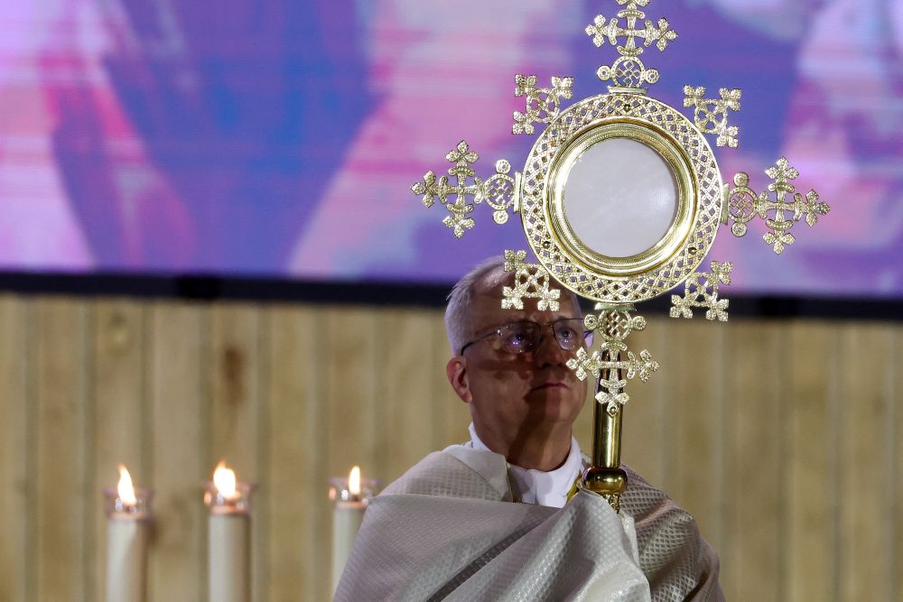 Pope Leo XIV holds the monstrance during a prayer vigil with young people at Plaza de Lima in Madrid June 6, 2026, during his apostolic journey to Spain. (OSV News/Reuters/Yara Nardi)
