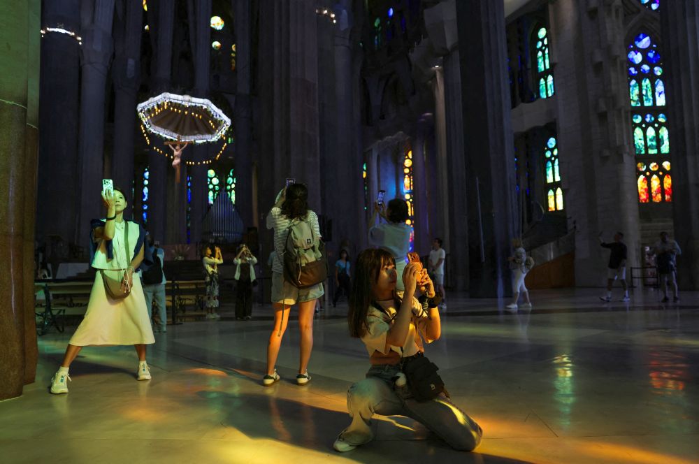 Tourists take pictures as they visit the Basilica of the Holy Family, or Sagrada Família, in Barcelona, Spain, June 2, 2026. Pope Leo XIV will visit the famed basilica during his June 6-12 apostolic visit to Spain. (OSV News/Reuters/Nacho Doce) 