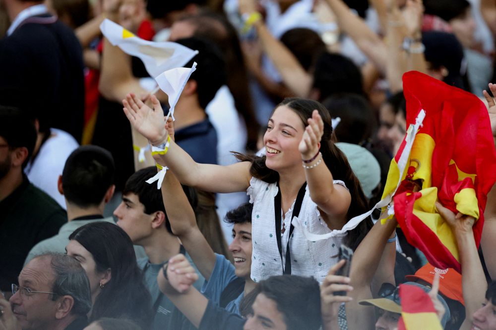 A young girl reacts to a musical performance on stage as youth gather ahead of a prayer vigil held by Pope Leo XIV at Plaza de Lima in Madrid June 6, 2026, during his apostolic journey to Spain. (OSV News/Reuters/Mohammad Salem)