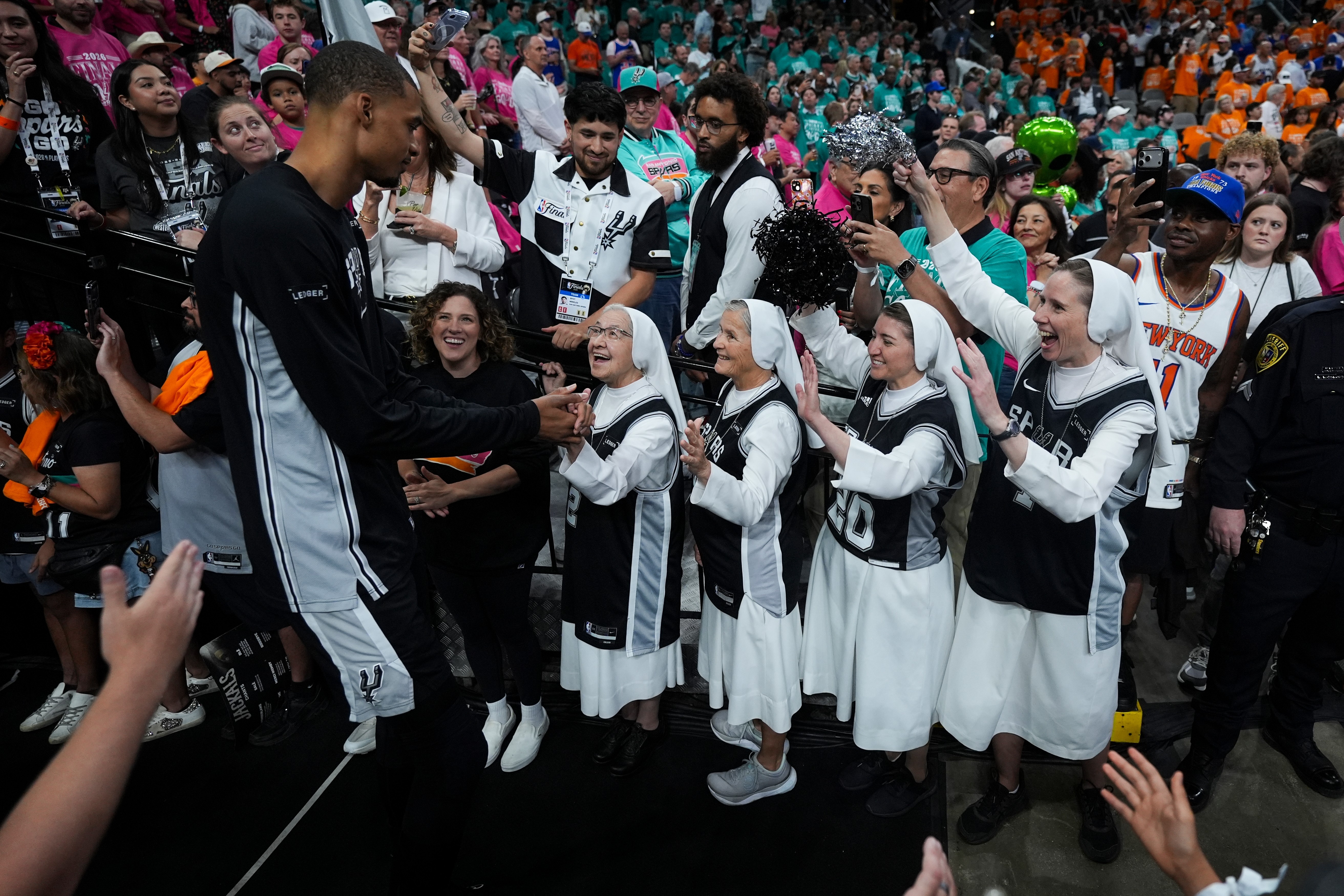 The Salesian Sisters greet players prior to Game 1 of the NBA Finals basketball series between the New York Knicks and the San Antonio Spurs
