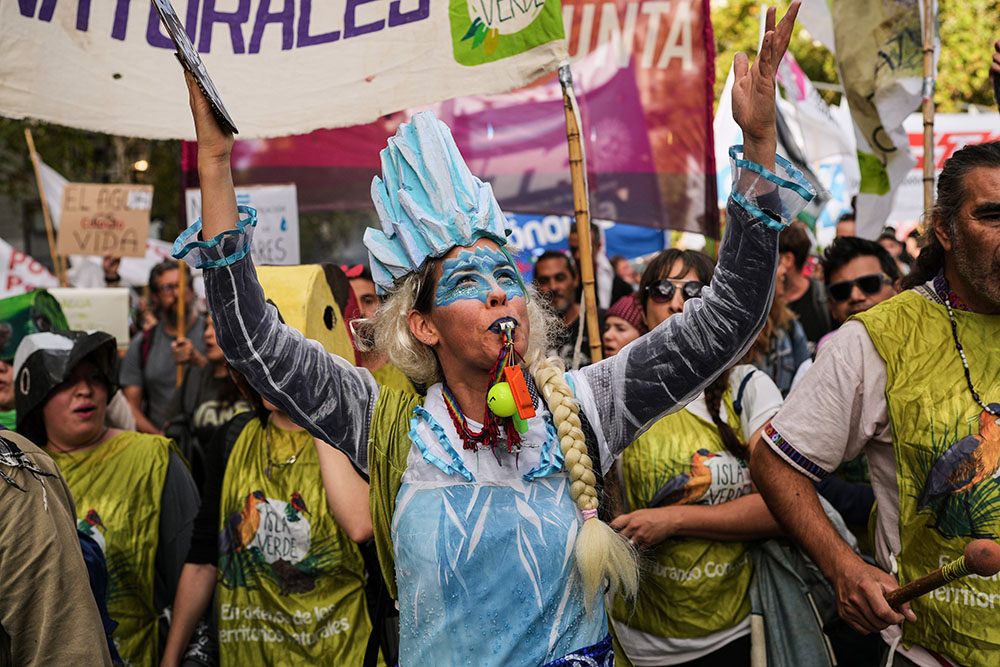 Demonstrators protest outside the Argentine National Congress building in Buenos Aires as lawmakers debate the Javier Milei government's proposal to reform Argentina's glacier protection law April 8, 2026. (AP/Rodrigo Abd)