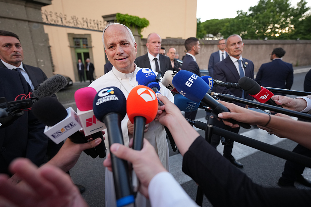 Pope Leo XIV talks to journalists as he leaves his residence in Castel Gandolfo, on the outskirts of Rome, to return to the Vatican June 16, 2026. (AP Photo/Andrew Medichini)