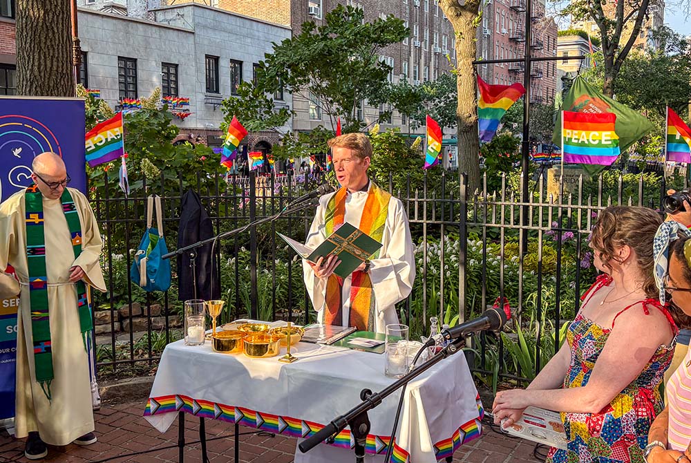 Paulist Fr. Chris Lawton, associate pastor at St. Paul the Apostle in New York, presides over a Pride Mass at the Stonewall National Monument in Christopher Park in New York June 25, 2026. (NCR photo/Camillo Barone)