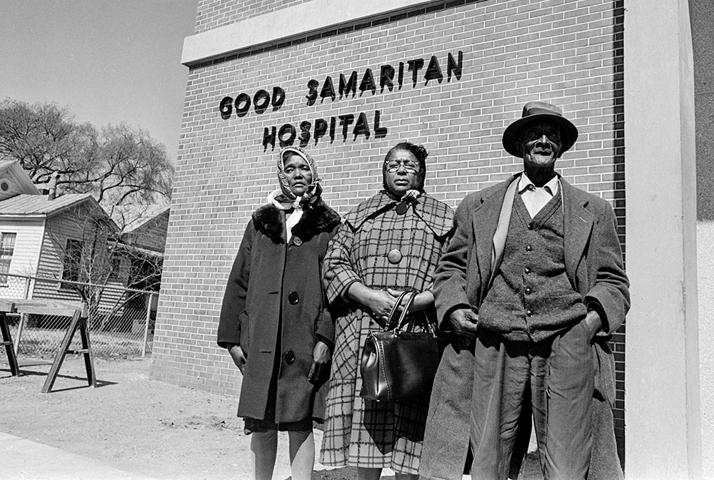 Family of Baptist Deacon Jimmie Lee Jackson are seen in front of Good Samaritan Hospital in Selma, Alabama, in February 1965, after a state trooper fatally shot Jackson during a voting rights march earlier that month. From left are Jackson's mother, Viola Jackson, his cousin Rachel Thomas and his grandfather Cager Lee. (AP/Horace Cort, File)