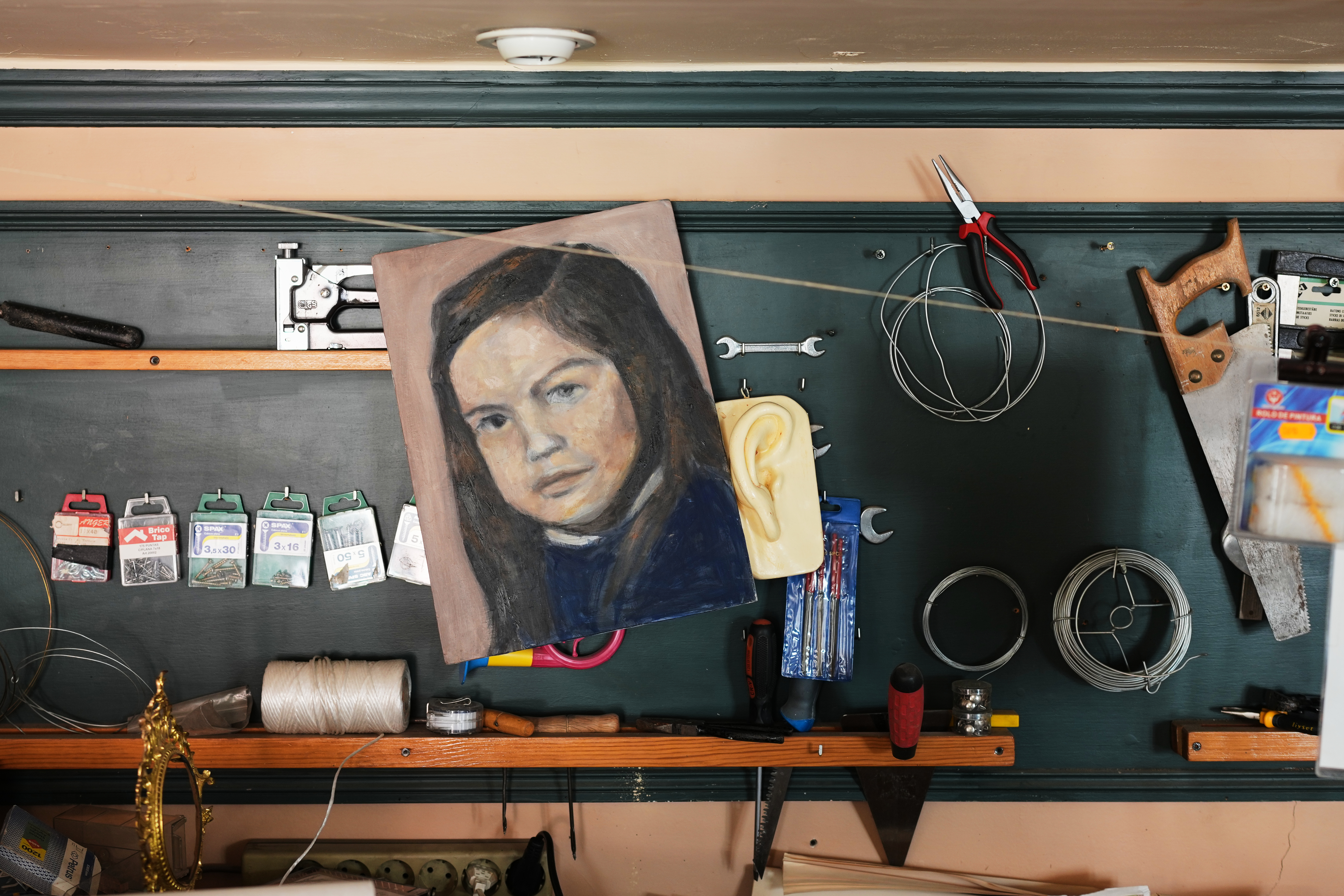 A childhood self-portrait by Paula Alonso-Pimentel hangs in the studio of her apartment in Madrid, Spain, Thursday, May 21, 2026. 