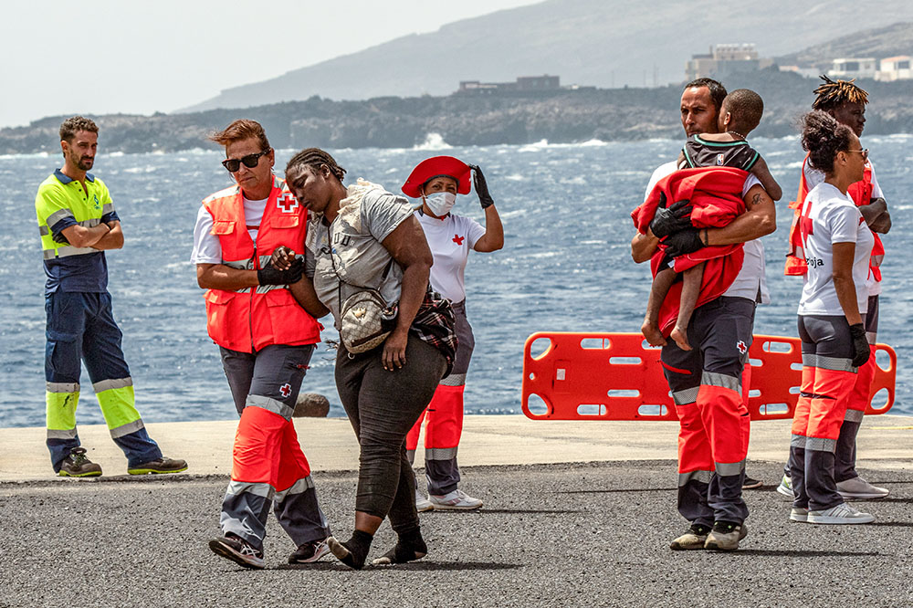 Migrants disembark at the port of La Estaca in Valverde at the Canary Island of El Hierro, Spain, Aug. 26, 2024, after a 13-day voyage by boat from the coast of Senegal. (AP/Maria Ximena)