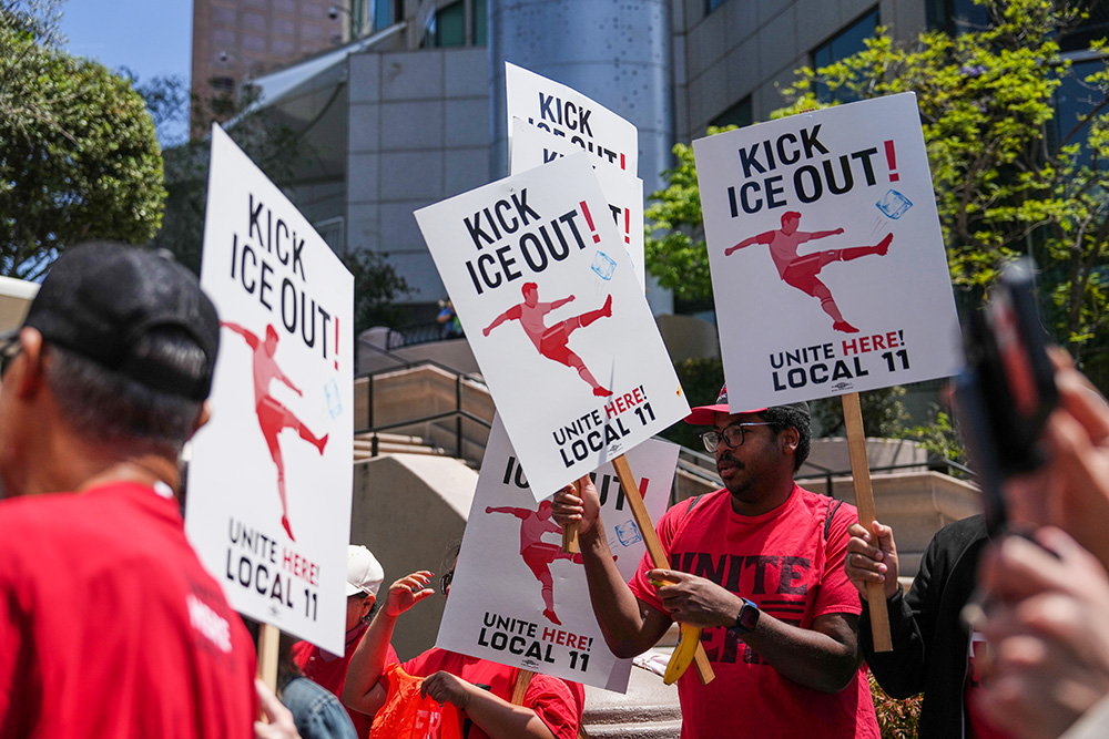 SoFi Stadium workers, belonging to union Local 11, picket outside of the FIFA Los Angeles World Cup 2026 Host Committee headquarters May 1, 2026, in Los Angeles. (AP/Jae C. Hong)