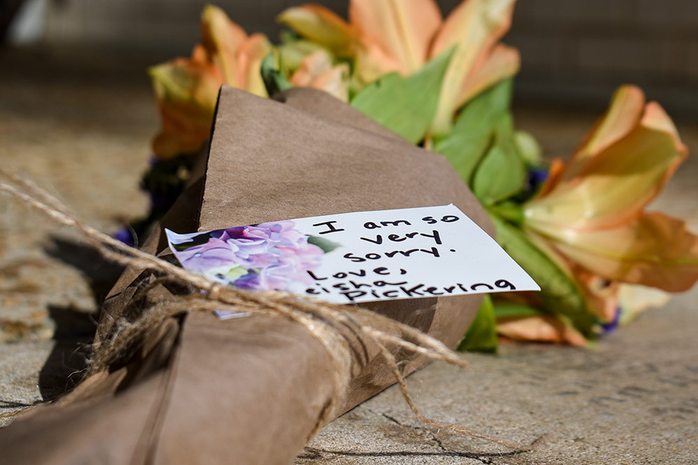 A note attached to a bundle of flowers left outside the Beth Israel Congregation reads, "I am so very sorry," on Jan. 12, 2026, in Jackson, Miss., after an arson attack significantly damaged the synagogue, the oldest in Mississippi. (AP/Sophie Bates)