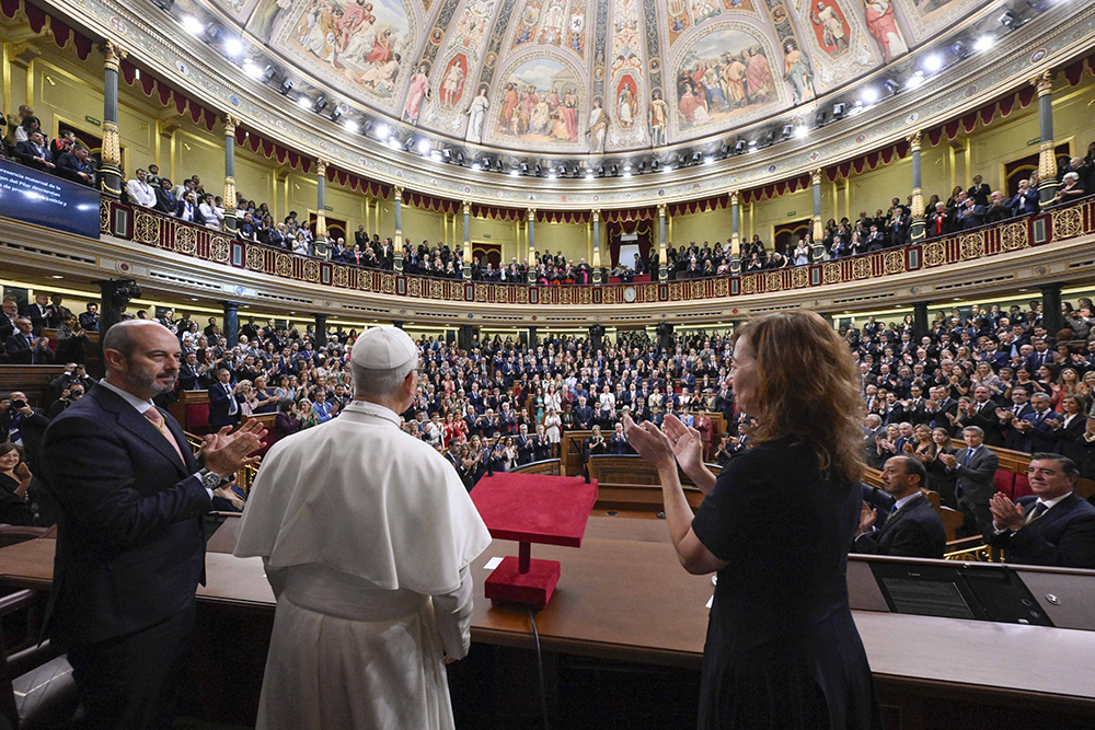 Pope Leo XIV is applauded by Pedro Rollan Ojeda, President of the Senate of Spain, and Francina Armengol, President of the Congress of Deputies of Spain, after the pontiff delivered a speech during a joint session of the Spanish Parliament at the Congress of Deputies in Madrid, June 8, 2026, during his June 6-12 apostolic journey to Spain. (OSV News/Vatican Media/Simone Risoluti)