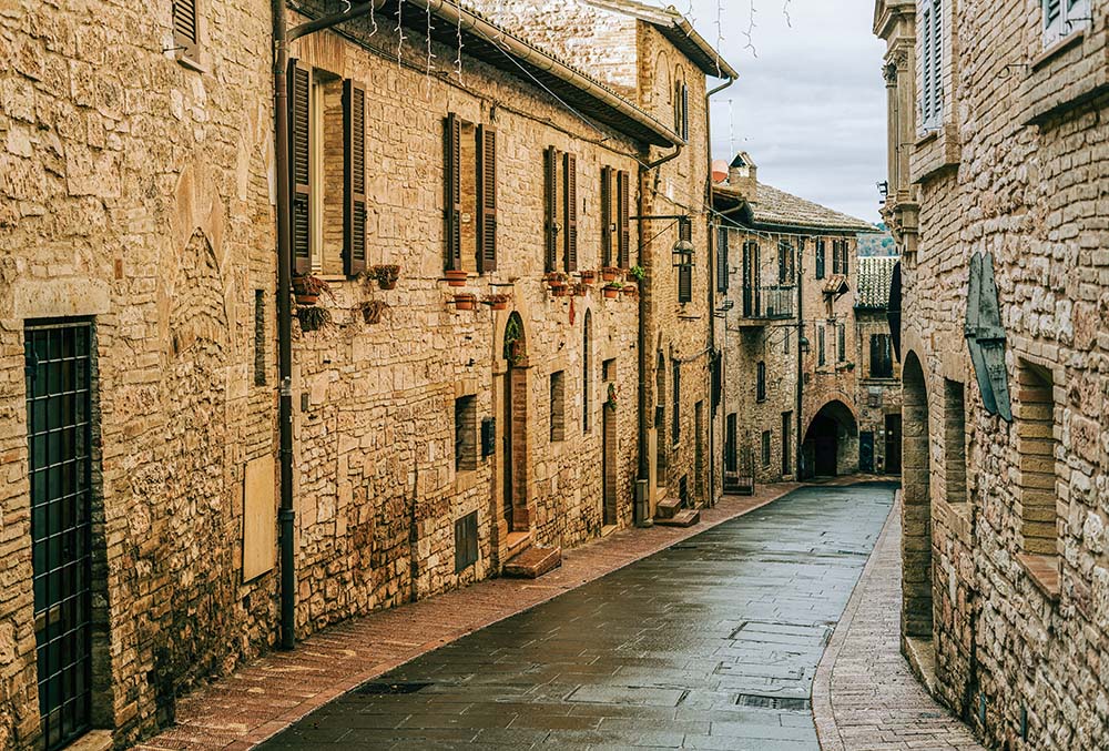 A medieval street in the town of Assisi, Italy (Unsplash/Gabriella Clare Marino)