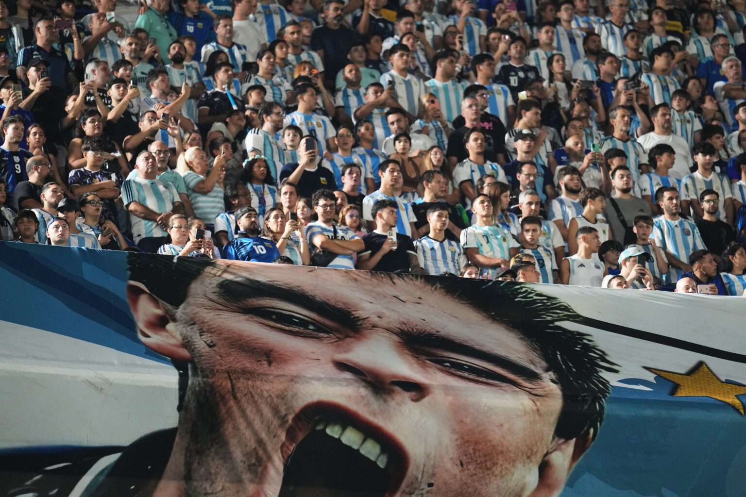 Argentine soccer fans watch a match