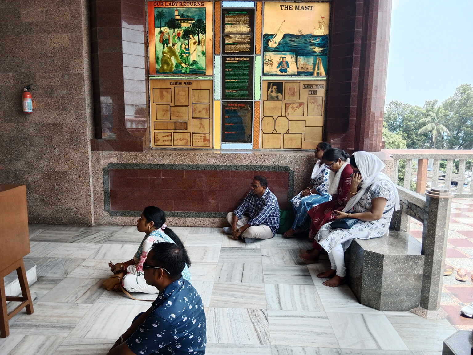 Devotees pray at the Basilica of the Holy Rosary, locally known as the Bandel Church