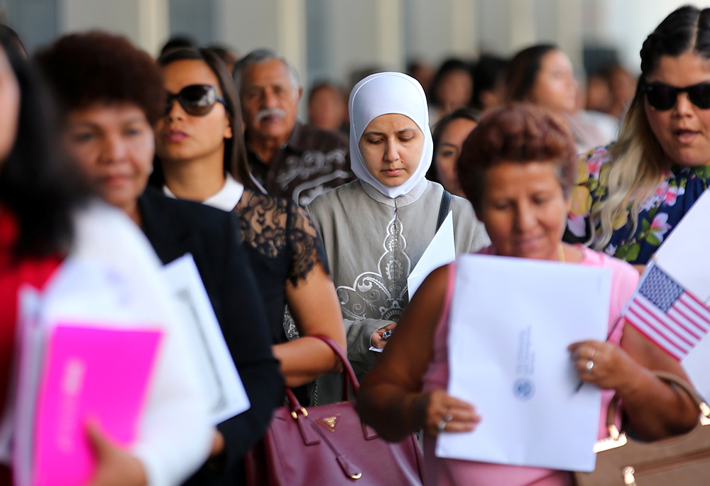 Naturalized citizens leave a swearing-in ceremony in Los Angeles, July 18, 2017. (CNS/Reuters/Mike Blake)