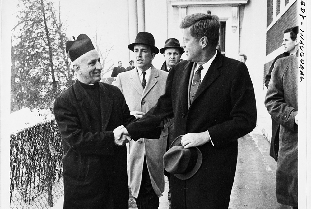 President-elect John F. Kennedy shakes hands with Fr. Richard J. Casey, pastor of Holy Trinity Church, after attending Mass at the church prior to inauguration ceremonies in Washington Jan. 20, 1961. (CNS/Library of Congress Prints and Photographs Division Washington)