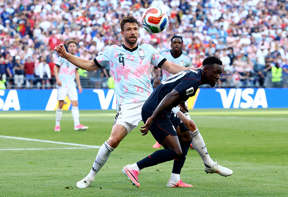 Folarin Balogun of the U.S. and Belgium's Brandon Mechele compete in the FIFA World Cup at Seattle Stadium July 6, 2026. (OSV News/Reuters/Albert Gea)