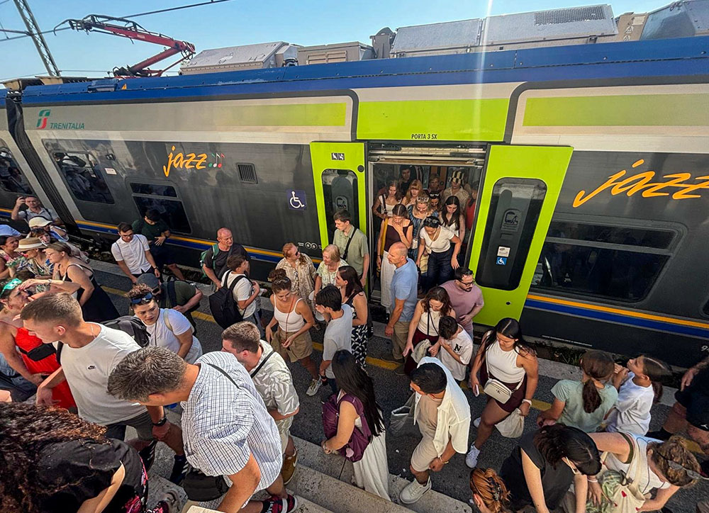 Pilgrims are seen leaving a packed train July 12, 2026, as they arrive at Castel Gandolfo, Italy, ahead of Pope Leo XIV's Sunday Angelus. (OSV News photo/Jan Guzik)