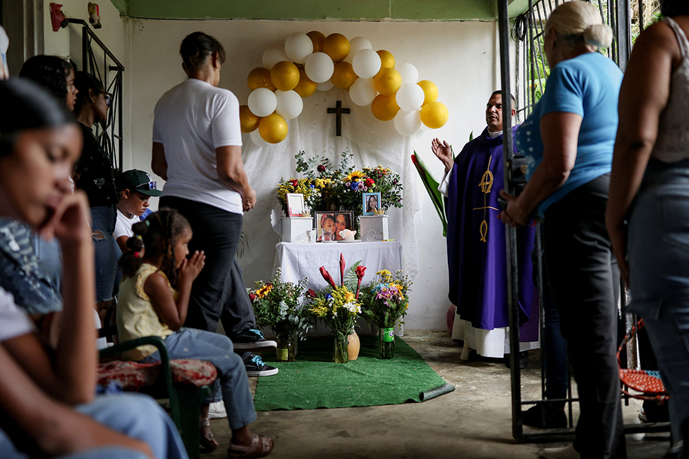 A priest celebrates a funeral Mass in La Guaira, Venezuela, July 15, 2026, for 2-year-old Kalani Martinez and her mother, Ashley Martinez, 29, victims of the earthquakes. Two catastrophic earthquakes hit Venezuela in quick succession June 24, leaving at least 5,000 dead with thousands still missing. (OSV News/Reuters/Pablo Sanhueza)