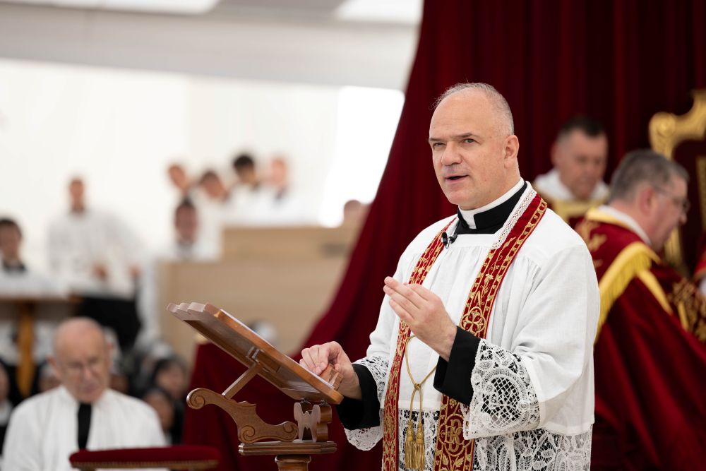 Fr. Davide Pagliarani, superior general of the Society of St. Pius X, gives the homily during a Mass in a tent outside the Society of St. Pius X seminary on July 1 in Écône, Switzerland. (Courtesy of Society of St. Pius X)
