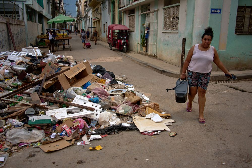 A woman carries a portable power charger during a blackout in Havana, Cuba, July 6, 2026. (AP/Ramon Espinosa)